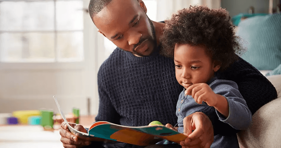 Father reading with child, representing child custody and parenting